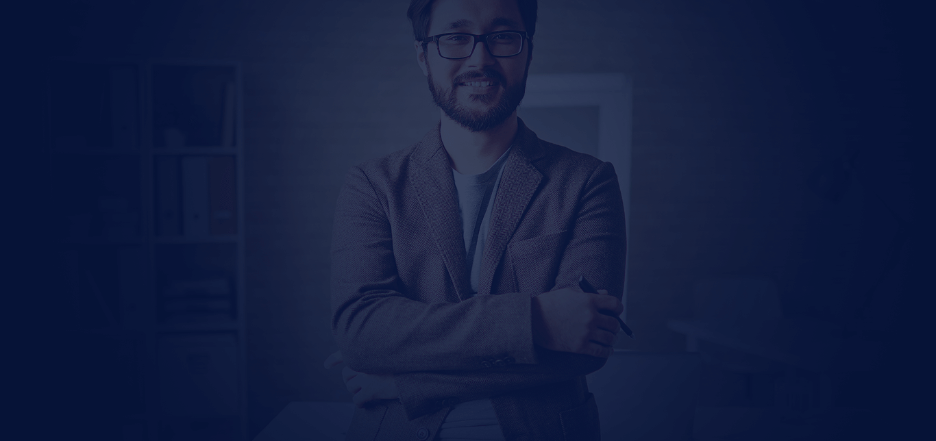 man wearing suit smiling