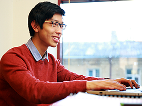 man using laptop for CMS development